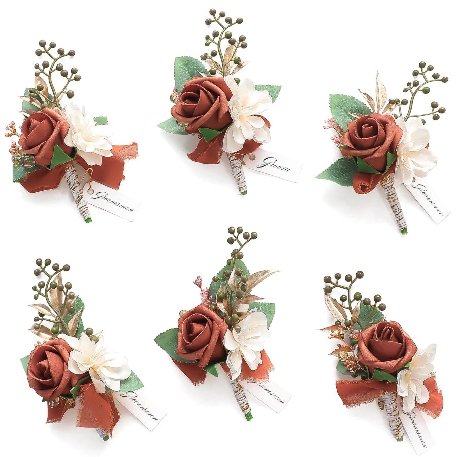 A set of six Floroom rose boutonnieres